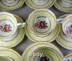 11 Antique Coalport Floral HP Yellow Gold Trim Footed Cup & Saucer Sets