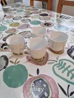 51 Piece Dinning Set. Harmony Bone China set with Gold rim around each iteam