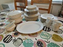 51 Piece Dinning Set. Harmony Bone China set with Gold rim around each iteam