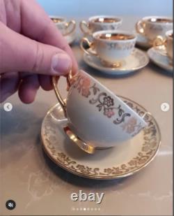 A stunning tea set including cups and saucers with a luxurious gold finish. The