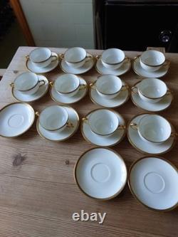 An 11 piece set of vintage Limoges soup cups and saucers