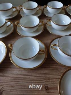 An 11 piece set of vintage Limoges soup cups and saucers