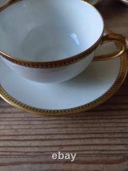 An 11 piece set of vintage Limoges soup cups and saucers