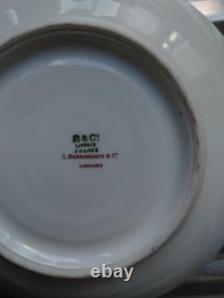 An 11 piece set of vintage Limoges soup cups and saucers