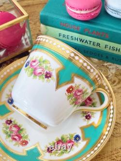 Brown Westhead Moore teacup and saucer, gilded, handpainted flowers, turquoise