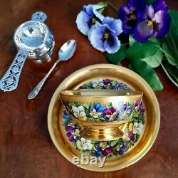 Extremely rare Vienna teacup and saucer, gilt and pansies by Anton Friedl, 1826