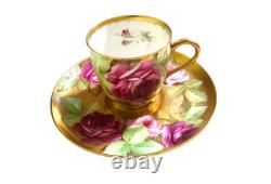Ginori cup and saucer hand painted with roses and gilded, signed by artist