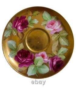 Ginori cup and saucer hand painted with roses and gilded, signed by artist
