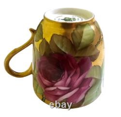 Ginori cup and saucer hand painted with roses and gilded, signed by artist