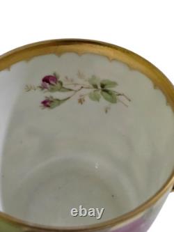 Ginori cup and saucer hand painted with roses and gilded, signed by artist