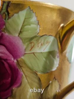 Ginori cup and saucer hand painted with roses and gilded, signed by artist