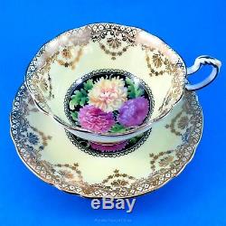 Gold Swag on Pale Yellow with Chrysanthemums on Black Paragon Tea Cup & Saucer