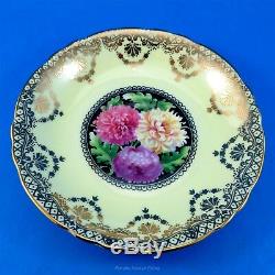 Gold Swag on Pale Yellow with Chrysanthemums on Black Paragon Tea Cup & Saucer