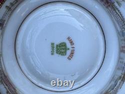 Hand-painted Nippon porcelain teacup and saucer with floral and gold decoration