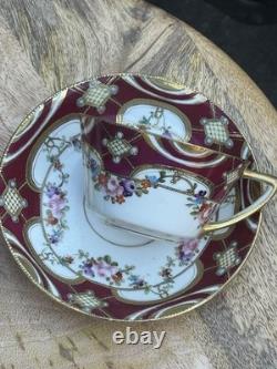 Hand-painted Nippon porcelain teacup and saucer with floral and gold decoration