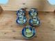 Marquis Fine China Handpainted And Carat Gold Set Of Five Tea Cups And Saucers