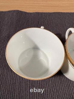Pair of Limoges ULIM Cups and Saucers, with gold trim