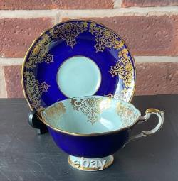 Paragon Cobalt Blue Rose Gold Rim Bone China Footed Cup and Saucer. Beautiful
