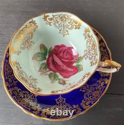 Paragon Cobalt Blue Rose Gold Rim Bone China Footed Cup and Saucer. Beautiful