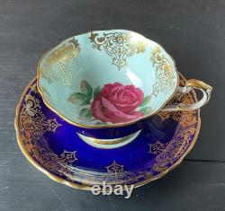 Paragon Cobalt Blue Rose Gold Rim Bone China Footed Cup and Saucer. Beautiful