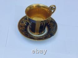 Paris (Darte Freres) porcelain Gold Ground Cup and Saucer with finely painted p