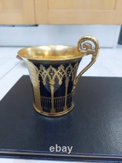 Paris (Darte Freres) porcelain Gold Ground Cup and Saucer with finely painted p