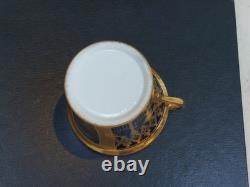 Paris (Darte Freres) porcelain Gold Ground Cup and Saucer with finely painted p