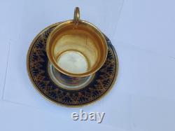 Paris (Darte Freres) porcelain Gold Ground Cup and Saucer with finely painted p