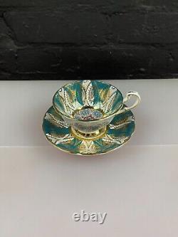 Rare Paragon Teacup and Saucer Gold Accents on Turquoise Panel