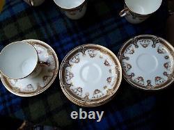 Rare Vintage Porcelain cups x12 and saucers X 5 white with gold and pink flower
