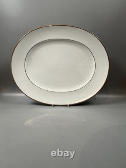 Set of classic Noritake P589 dinner ware for six white with gold rim and gold