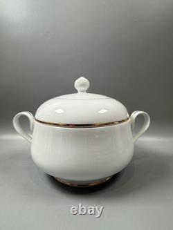 Set of classic Noritake P589 dinner ware for six white with gold rim and gold