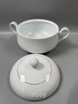 Set of classic Noritake P589 dinner ware for six white with gold rim and gold