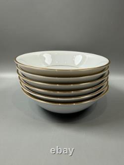 Set of classic Noritake P589 dinner ware for six white with gold rim and gold