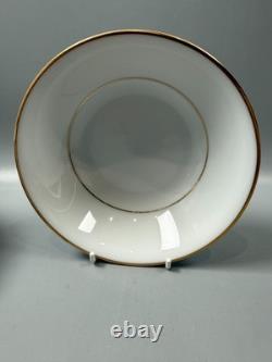 Set of classic Noritake P589 dinner ware for six white with gold rim and gold