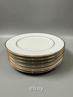 Set of classic Noritake P589 dinner ware for six white with gold rim and gold