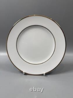 Set of classic Noritake P589 dinner ware for six white with gold rim and gold