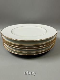 Set of classic Noritake P589 dinner ware for six white with gold rim and gold