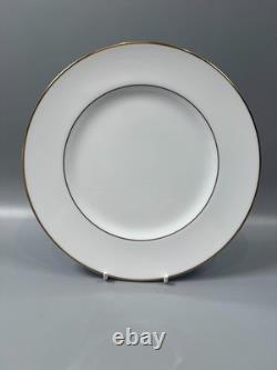 Set of classic Noritake P589 dinner ware for six white with gold rim and gold
