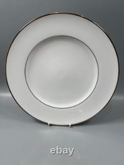 Set of classic Noritake P589 dinner ware for six white with gold rim and gold